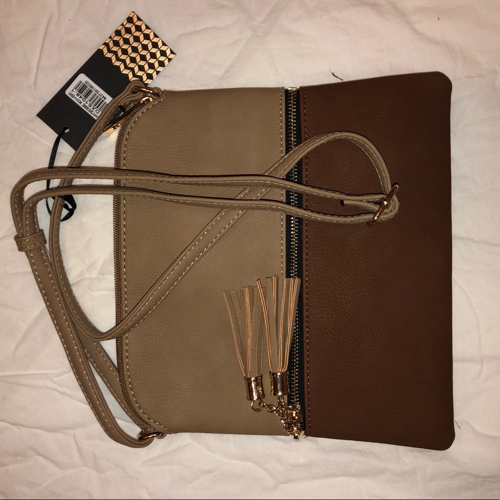 Adorable brown and gold Deluxity bag with tags